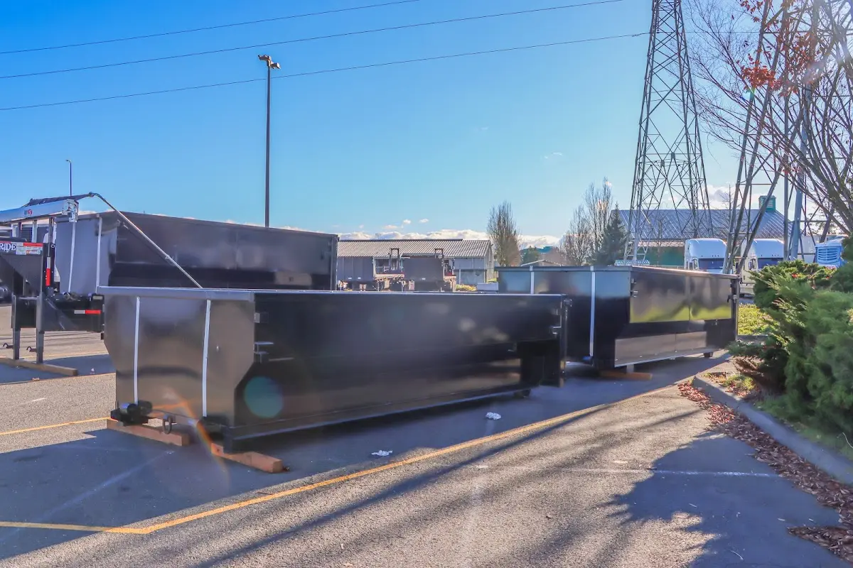 Roll-off dumpster ready for waste disposal at job site for 2 Yard Dumpster Rental in Philomath